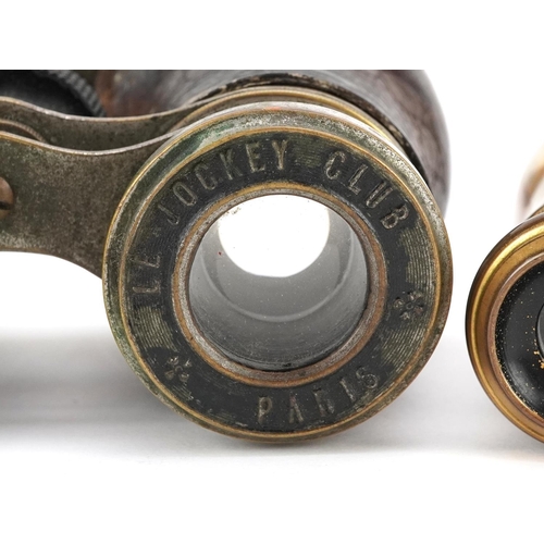 1007 - A pair of early 20th century French Le Jockey Club binoculars, 11cm wide, together with a pair of mo... 