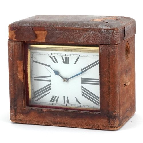 93 - A French Art Deco gilt brass carriage clock, the white enamelled dial with Roman numerals, presented... 