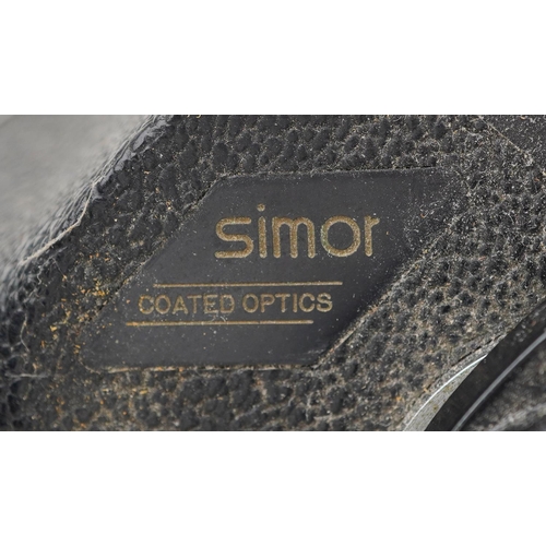 1010 - A pair of Simor 7 x .50 field binoculars, registration number 37891, together with a pair of Opticro... 