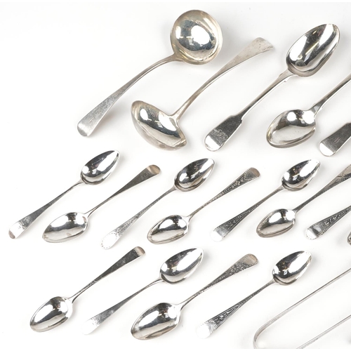 583 - A collection of Georgian and later silver flatware including two pairs of sugar tongs, two ladles an... 