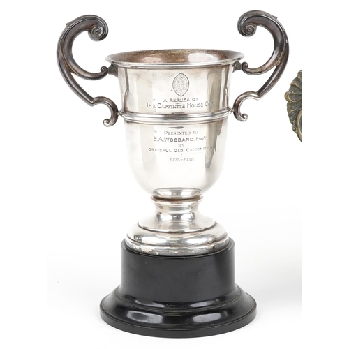 587 - A George V silver twin handled trophy engraved A Replica of the Caffinite House Cup presented to E A... 