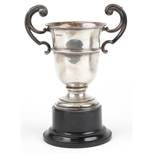 587 - A George V silver twin handled trophy engraved A Replica of the Caffinite House Cup presented to E A... 