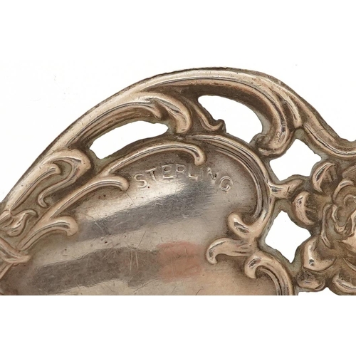 156 - An Art Nouveau style sterling silver handled and steel measure, 11.5cm in length.