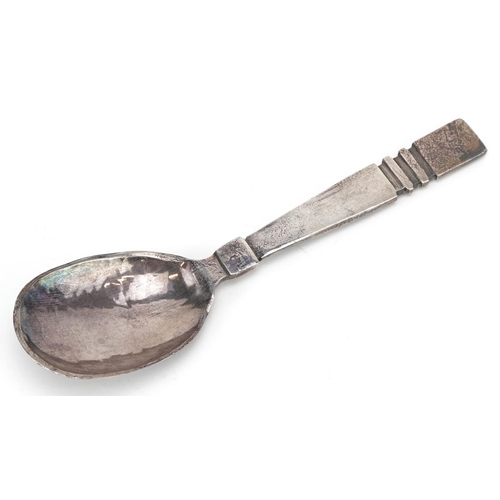 585 - Arthur C Kemp, an Arts & Crafts style silver spoon with planished bowl, Birmingham 1943, 15cm in len... 