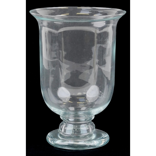 1171 - A 20th century clear glass hurricane lamp on a footed base, H-30cm