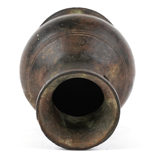 197 - A Heavy Bronze Ovoid Vase, 17th/18th century, probably Indian, formerly with a handle, H-19cm.