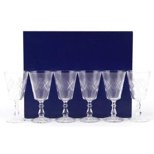 489 - A set of six Royal Eastbourne Golf Club cut glass wine glasses dated 1887-1987, cased.