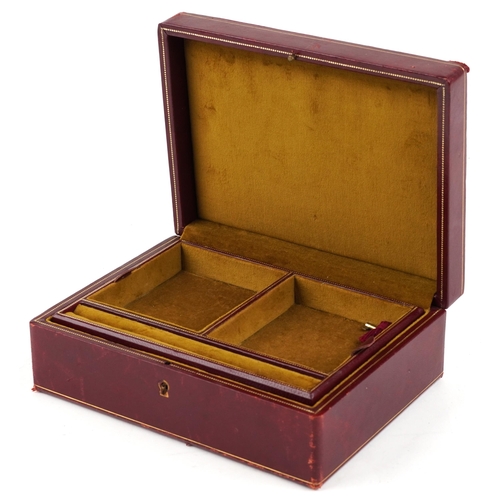 3816 - An early 20th century red leather jewellery box with silvered and gilt tooled decoration, 24cm wide.