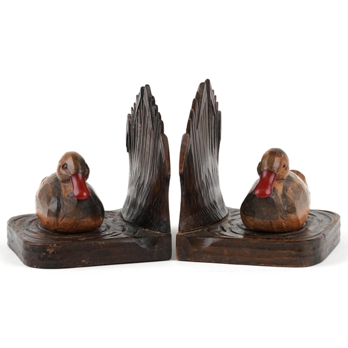 322 - A pair of early 20th century Black Forest style carved walnut bookends in the form of two ducks with... 