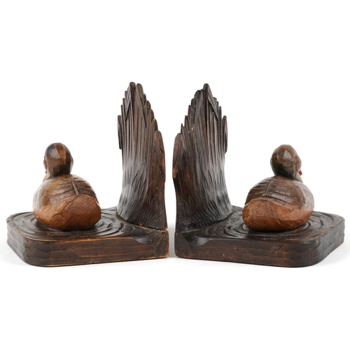 322 - A pair of early 20th century Black Forest style carved walnut bookends in the form of two ducks with... 