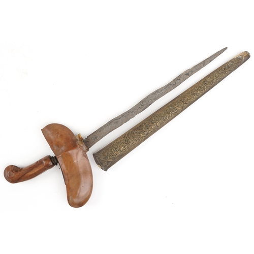 2532 - A vintage Indonesian kris knife with scabbard, 50.5cm in length.