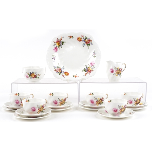 488 - A Coalport six place tea service hand painted with flowers.