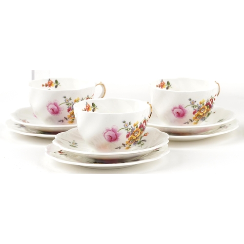 488 - A Coalport six place tea service hand painted with flowers.