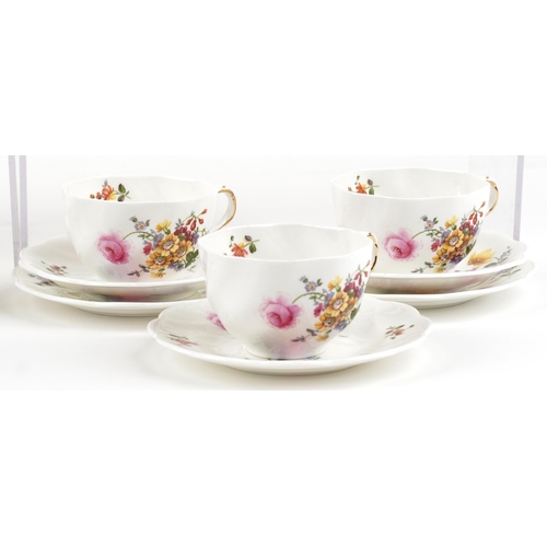 488 - A Coalport six place tea service hand painted with flowers.