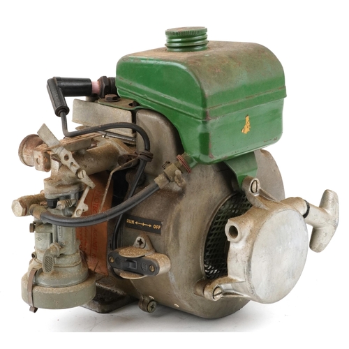 1128 - A vintage 50cc/75cc horizontal shaft four stroke engine.