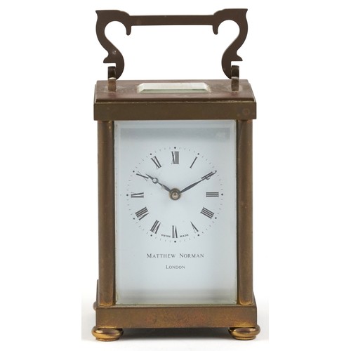 233 - A mid 20th century gilt brass carriage clock, the white enamelled dial with black Roman numerals, de... 