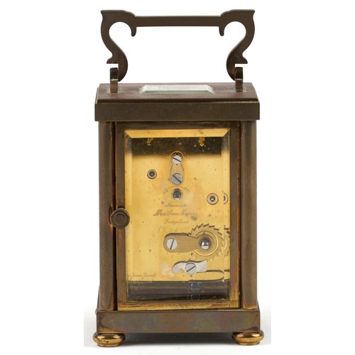 233 - A mid 20th century gilt brass carriage clock, the white enamelled dial with black Roman numerals, de... 