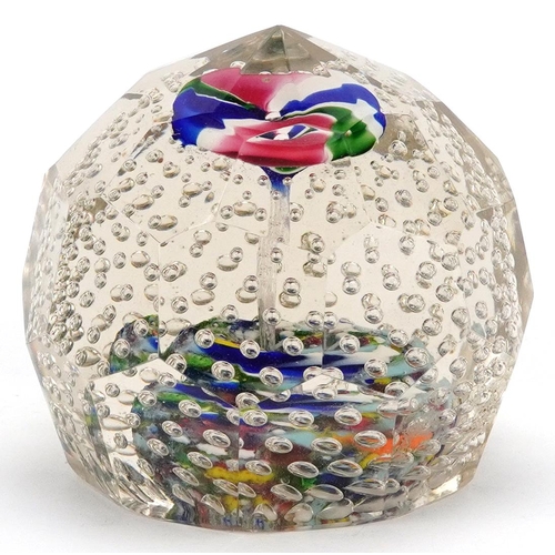 484 - An early 20th century, possibly German, glass paperweight with bubbled interior and coloured glass f... 