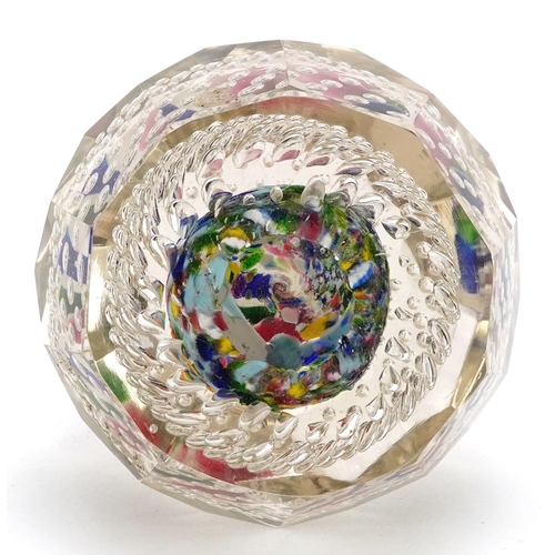 484 - An early 20th century, possibly German, glass paperweight with bubbled interior and coloured glass f... 