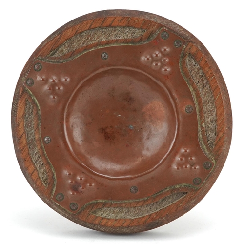 335 - An Arts & Crafts Newlyn School copper & oak pin tray, diameter 15cm.