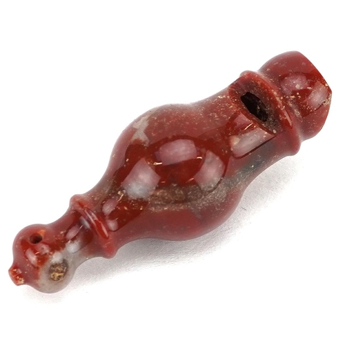 1200 - An unusual 20th century agate model of a miniature whistle, of turned baluster form, with piercing f... 