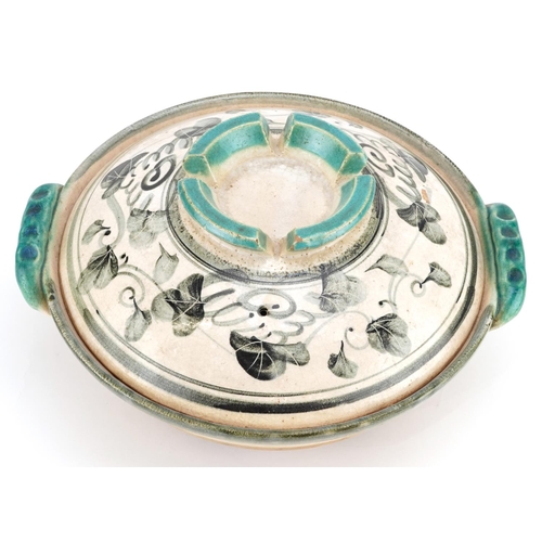 357 - A earthenware tagine, Turkey circa 1920, the cover with turquoise glazed indented corona, the bowl w... 