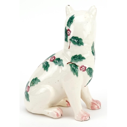 65 - A greamware Galle style cat, circa 1920, Bovey Tracey, the body decorated with sprigs of foliage and... 