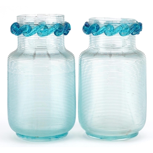 70 - A pair of Victorian pale blue glass beaker vases, circa 1880, each with a wave form frilly border, o... 