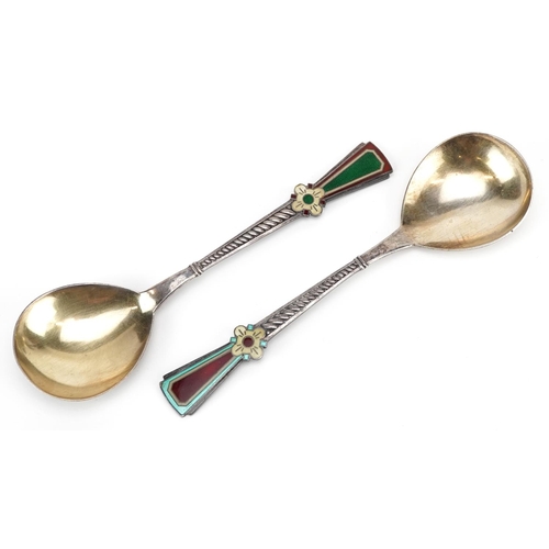 560 - A pair of Russian parcel gilt & enamelled Secessionist spoons, each with a shallow bowl and 'Mediaev... 