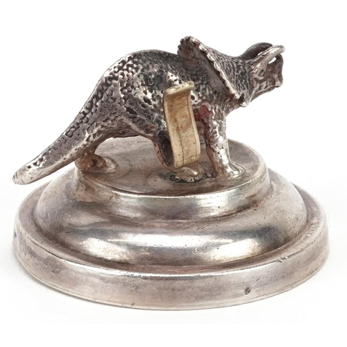 89 - A novelty .925 silver menu card holder, modelled as a Triceratops, on a stepped plinth, stamped 925,... 