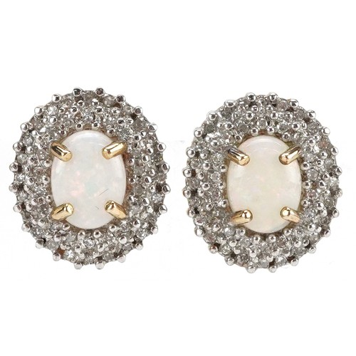 3054 - A pair of 9ct gold cabochon opal and diamond cluster stud earrings, 14.8mm high, total 3.9g.