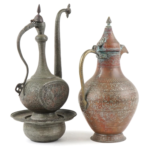 195 - An early 20th century Middle Eastern copper hot water jug, 46cm high, together with a similar jug.