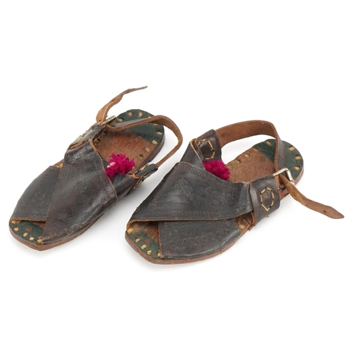 320 - A pair of early/mid 20th century child's leather sandals, probably Spanish, 16cm in length.