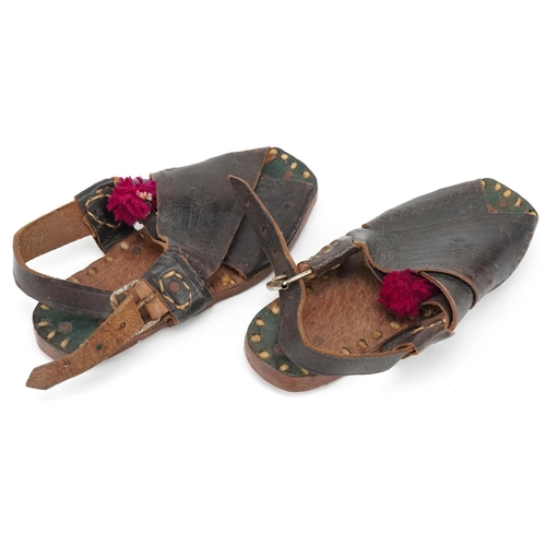 320 - A pair of early/mid 20th century child's leather sandals, probably Spanish, 16cm in length.