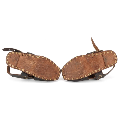 320 - A pair of early/mid 20th century child's leather sandals, probably Spanish, 16cm in length.