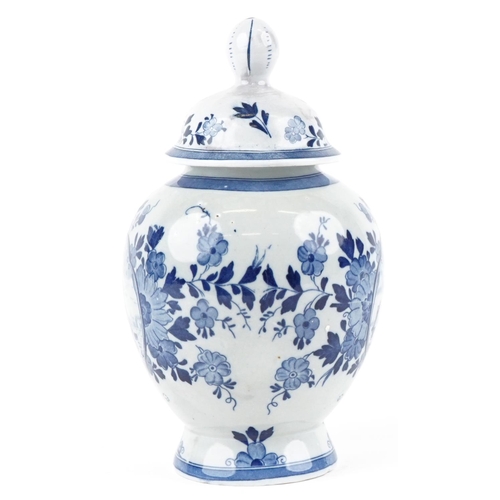 1197 - A 20th century Dutch Delft blue and white vase and cover, 26cm high.