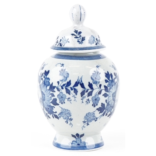 1197 - A 20th century Dutch Delft blue and white vase and cover, 26cm high.