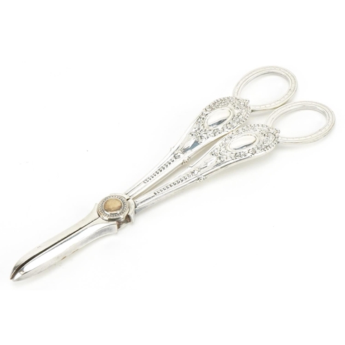 556 - A pair of Victorian silver plated grape scissors housed in a velvet and silk lined fitted case, 17cm... 