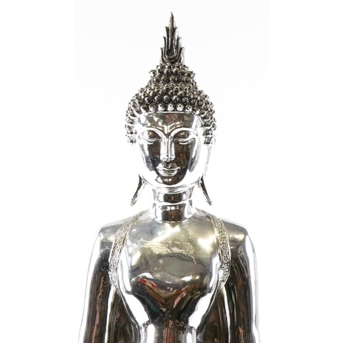 1172 - A large silvered figure of a Thai Buddha, 65cm high.