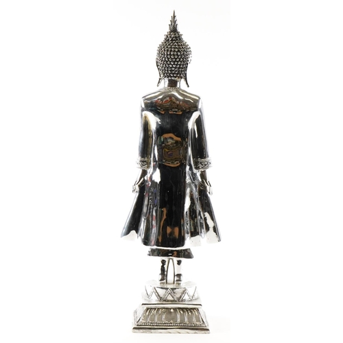 1172 - A large silvered figure of a Thai Buddha, 65cm high.