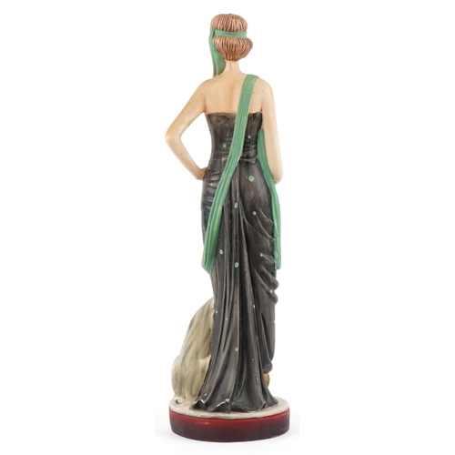 1158 - A large Art Deco style study of a female standing with a Greyhound, 64.5cm high.