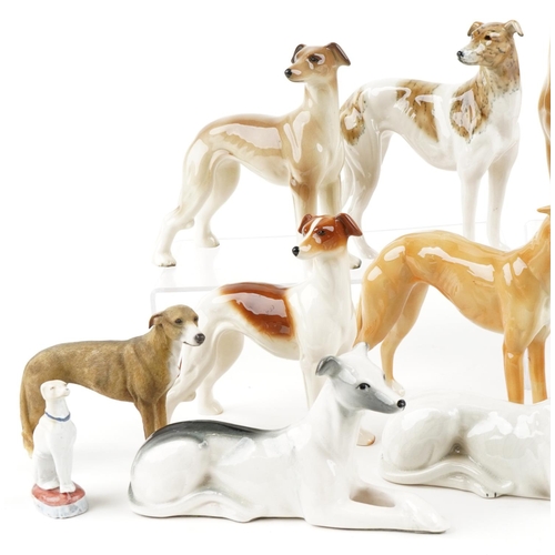 1237 - A collection of porcelain, pottery and resin models of Greyhounds, the largest 25cm in length.