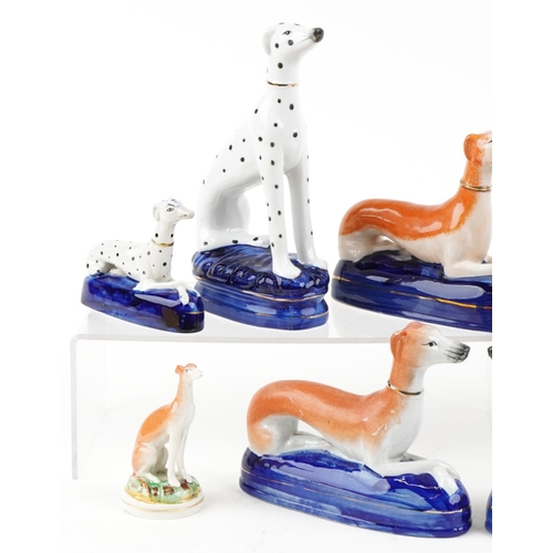 1131 - A small collection of Victorian style Greyhounds including inkwells, the largest 21cm high.