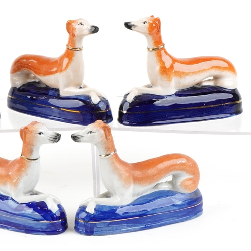 1131 - A small collection of Victorian style Greyhounds including inkwells, the largest 21cm high.