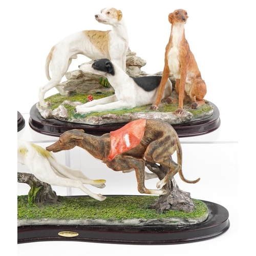 1152 - Three decorative resin sculptures of Greyhounds including a Juliana Collection, the largest 50cm wid... 