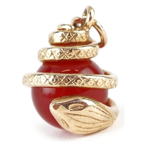 3178 - A 9ct gold and carnelian pendant in the form of a serpent, 2cm high, 6.6g.