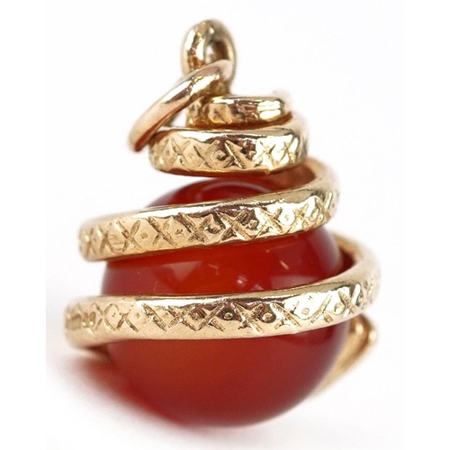 3178 - A 9ct gold and carnelian pendant in the form of a serpent, 2cm high, 6.6g.