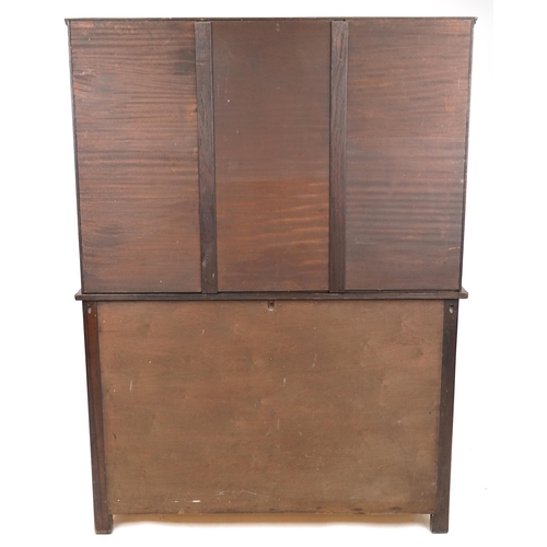 2030 - An early/mid 20th century oak dresser, the shelf back above two drawers and a pair of cupboards on s... 