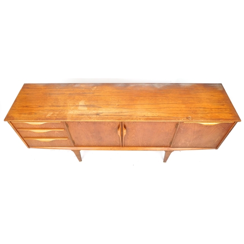 2001 - A mid 20th century teak sideboard by Jentique Furniture fitted with an arrangement of drawers and cu... 