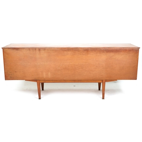 2001 - A mid 20th century teak sideboard by Jentique Furniture fitted with an arrangement of drawers and cu... 